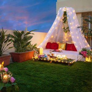 Boho candle light dinner decoration with rustic table setup, macrame accents, candles, and warm ambient lighting