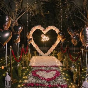 Engagement celebration candle light dinner decoration with romantic setup, candles, floral décor, ring theme accents, and warm ambient lighting