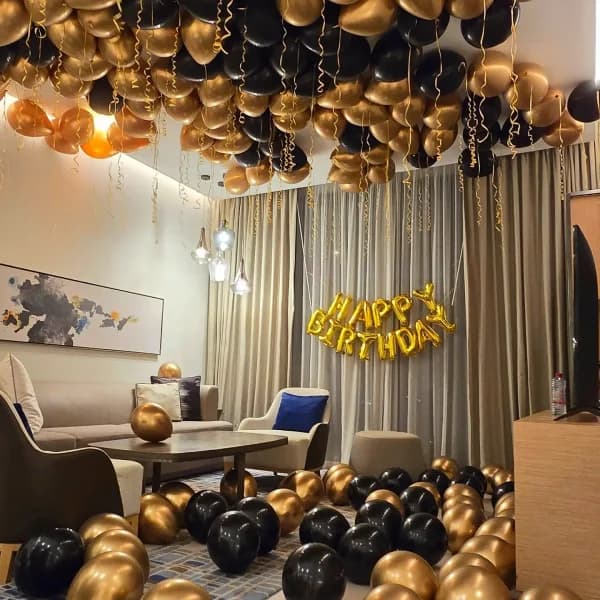 Living room balloon decoration setup for birthday celebration in Bangalore