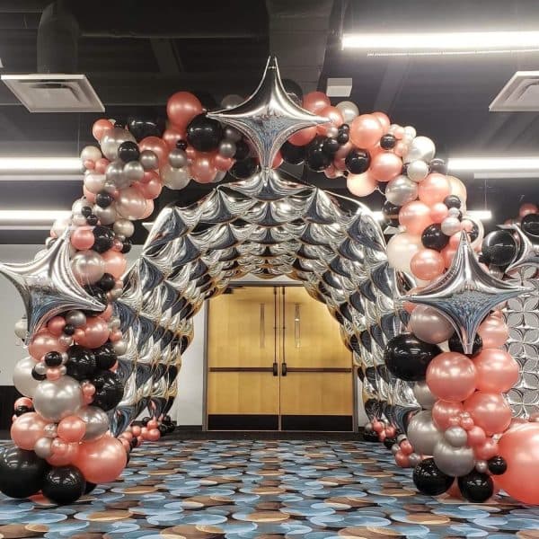 Metallic balloon arch decoration setup for birthday party in Bangalore