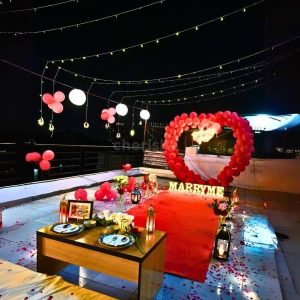 Valentine’s Day candle light dinner decoration with romantic setup, red roses, candles, heart décor, and warm ambient lighting