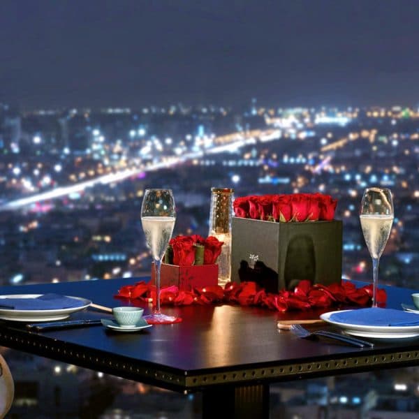 Simple candle light dinner setup at home with candles, rose petals, and elegant table decor for a romantic evening 21