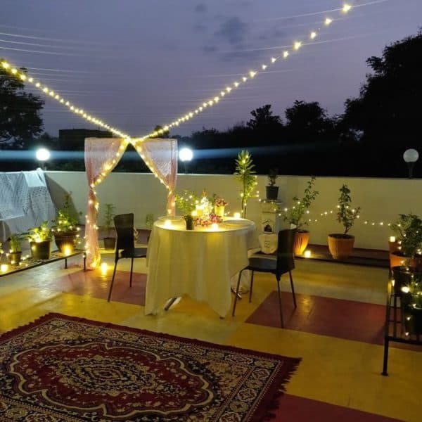 22 Simple candle light dinner setup at home with candles, rose petals, and elegant table decor for a romantic evening