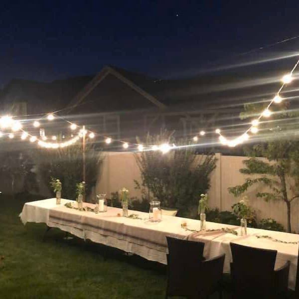 Simple candle light dinner setup at home with candles, rose petals, and elegant table decor for a romantic evening 26