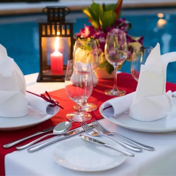 28 Simple candle light dinner setup at home with candles, rose petals, and elegant table decor for a romantic evening