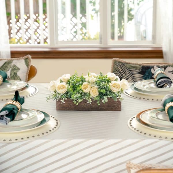 A minimal yet romantic candle light dinner setup with soft lighting, candles, and elegant table styling 9