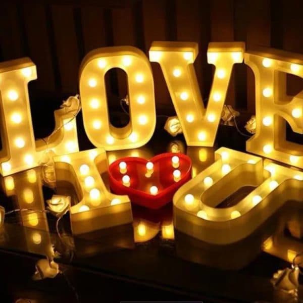 Simple candle light dinner setup at home with candles, rose petals, and elegant table decor for a romantic evening 7