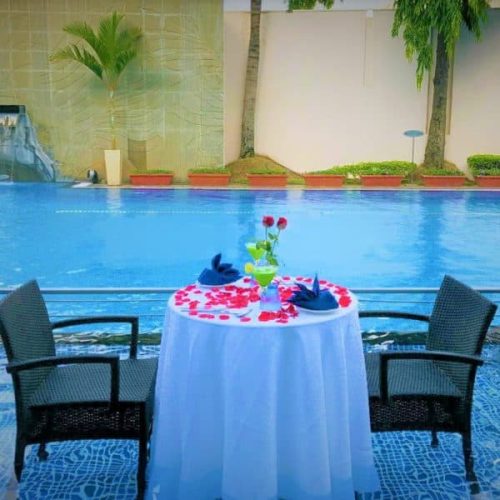 24 Simple candle light dinner setup at home with candles, rose petals, and elegant table decor for a romantic evening